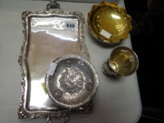 A parcel of continental silver including twin-handled tray, three-footed dish, silver compact,