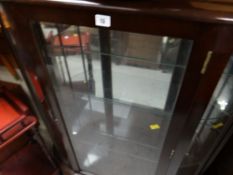 A vintage polished single-door china cabinet