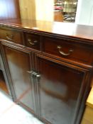 An Oriental hardwood bookcase with upper drawers