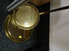 A small brass circular mirror together with a brass bed warming pan