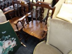 Four dark stained pine kitchen chairs together with another