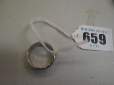 A modern plain platinum wedding band with small diamond, 10grams gross