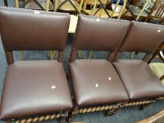 A set of three barley-twist legged & studded dining chairs