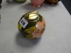 A Moorcroft green ground Slipper Orchid table lighter