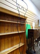 A black metal clothes display stand