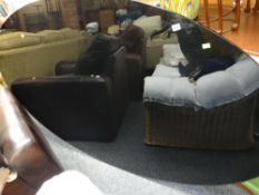 A modern oval black glass dining table with chrome leg base