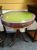 A small reproduction drum-type table with drawer
