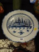 A nineteenth century creamware pottery blue & white charger