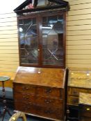 An antique bureau bookcase with astragal glazed top & good fitted interior (minor damage)