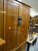 An Oriental hardwood standing two-door cupboard
