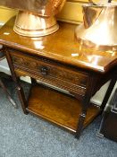 A reproduction carved side table