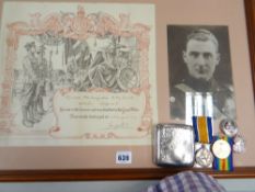 A framed honorary discharge notice for Augustus Reginald Morgan-Smith together with his silver