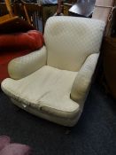 A modern Marks & Spencer cream coloured patterned armchair