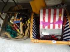 A basket of linen etc & a basket of home tools etc