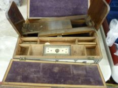 Indian inlaid writing slope and an embossed pewter decorated sliding book rack