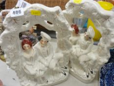 Pair of Staffs pottery flatbacks depicting figures in an arbour