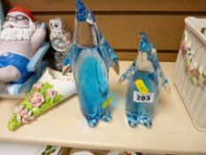 Two heavy art glass penguins