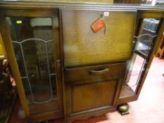 Polished wood display cabinet with centre bureau