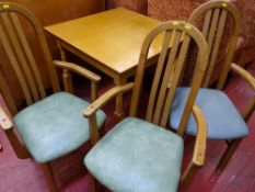Small square table with three wooden and upholstered elbow chairs