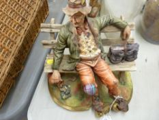 Capodimonte figurine of a tramp on a bench