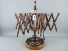 Circular based treen and brass 'Concertina' wool winder in fine order