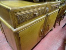 Light oak sideboard with carved drawers and two base cupboards