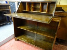 Polished wood two shelf bookcase having a drop down bureau section