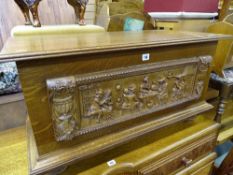 Light oak blanket box with carved front panel