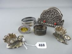 Two silver serviette rings, a pair of EP fruit salts and a set of EP coasters in a stand