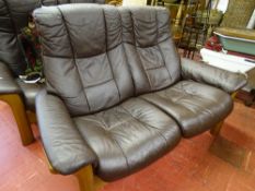 Brown faux leather wooden framed two seater recliner couch by Ekornes