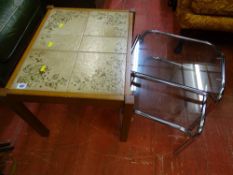 Small tiled top coffee table and a nest of two metal framed and glass topped tables