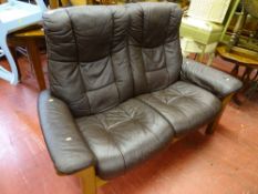 Brown faux leather wooden framed two seater recliner couch by Ekornes