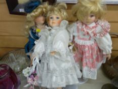 Three modern porcelain headed dolls
