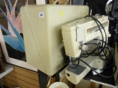 Vintage electric Singer sewing machine in case with foot pedal