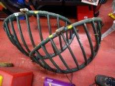 Pair of cast metal feeding mangers