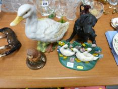 Parcel of three animal ornaments and a trio of ducks metal doorstop
