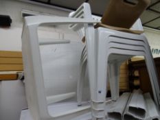 Parcel of white plastic garden furniture - four chairs, circular table, small table