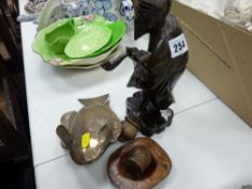 Singaporean carved wood figure of an old man and a Singaporean white metal, possibly silver