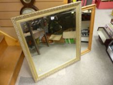 Good gilt framed bevelled wall mirror and a pine framed wall mirror of slightly smaller size