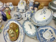 Mixed selection of blue and white dinnerware, two cheese dishes and covers and two antique style