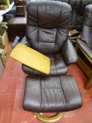 Brown faux leather easy chair with table attachment and footstool by Ekornes
