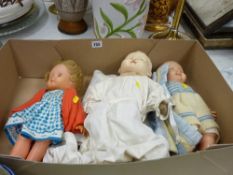 Three dressed dolls
