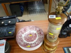 Eight pink and white decorated dinner plates and a treen table lamp with hunting print decoration