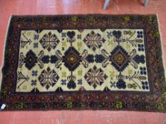 Old Baluchi carpet runner having cream ground central panel with traditional motif and double full