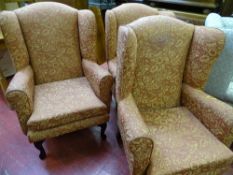 Three matching upholstered wingback chairs