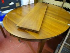 French inlaid mahogany extending dining table with single additional leaf, on tapering supports with