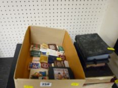 Small collection of novelty matches, two photograph albums, English Dictionary and other books