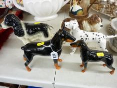 Five pottery standing dogs - one Beswick, one Sylvac, one Coopercraft and two others