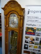 Modern Howard Miller moon dial grandfather clock, triple weight, chiming timepiece with oversized