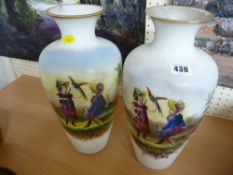 Pair of Continental milk glass vases with figures of children (rim damage to one)